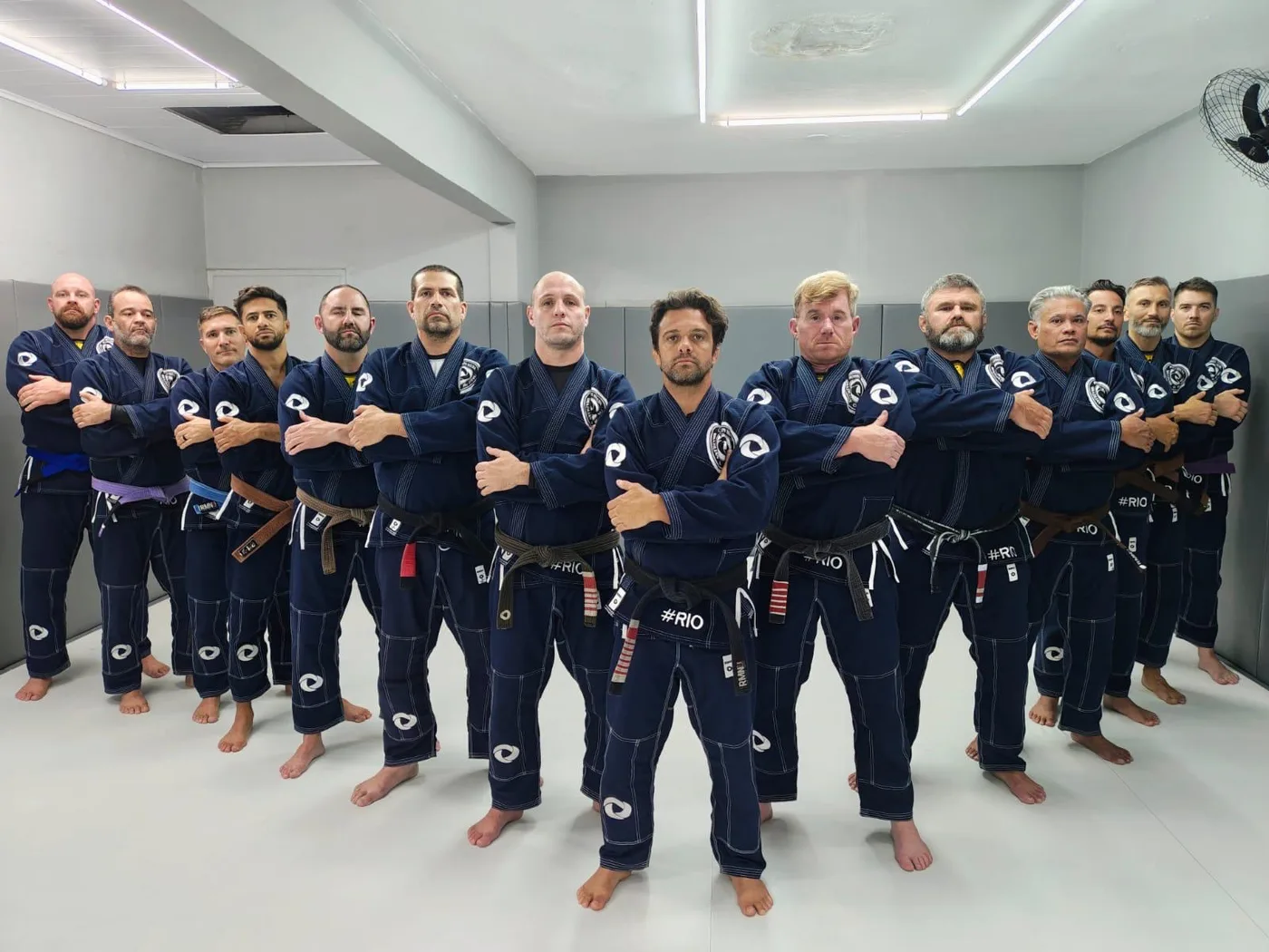 Robson Moura standing with the adult team at the Tampa academy
